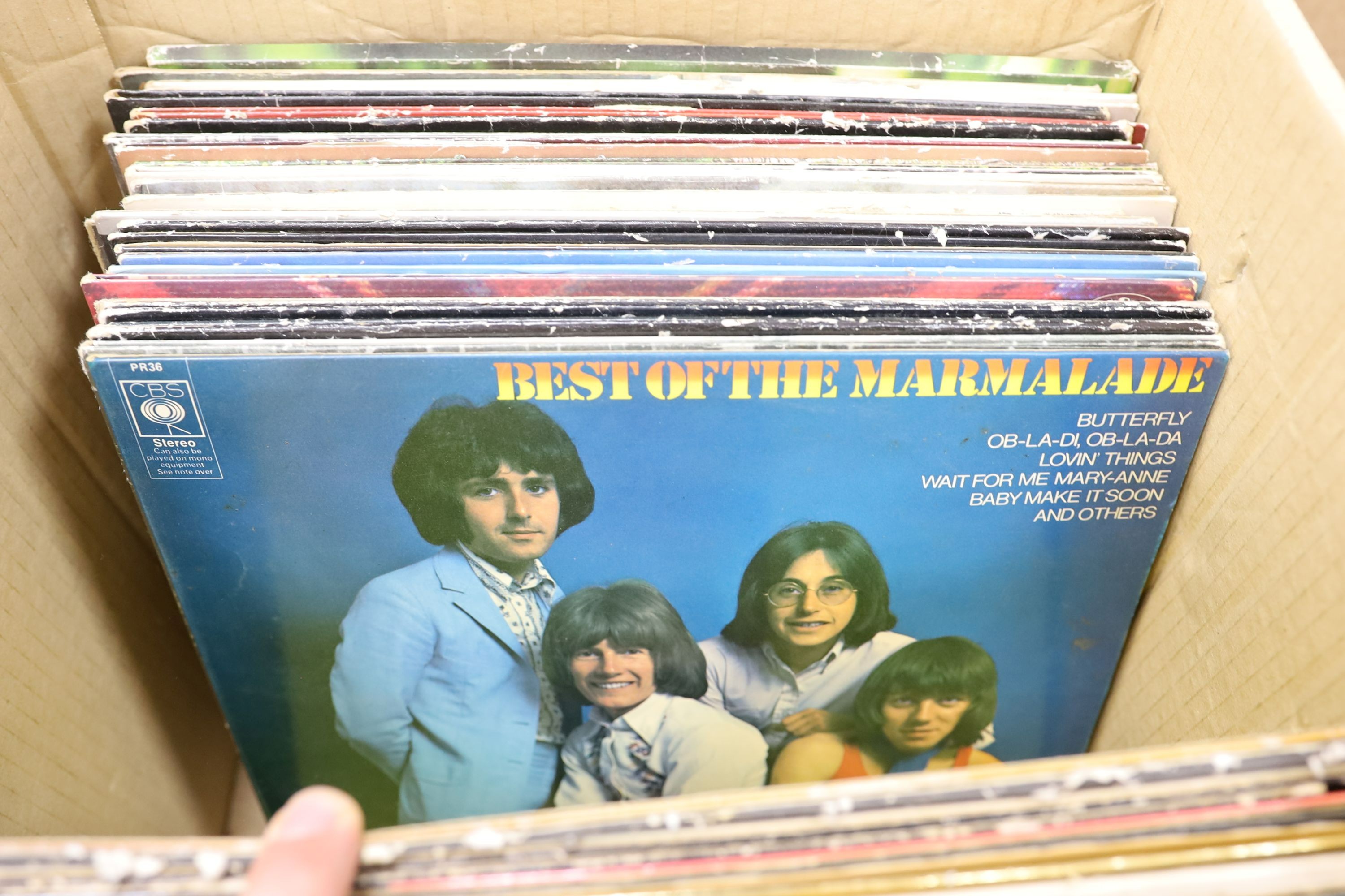 A collection of approximately 87 vinyl LPs to include The Beatles, David Bowie, Traffic, 10CC, Carly Simon etc